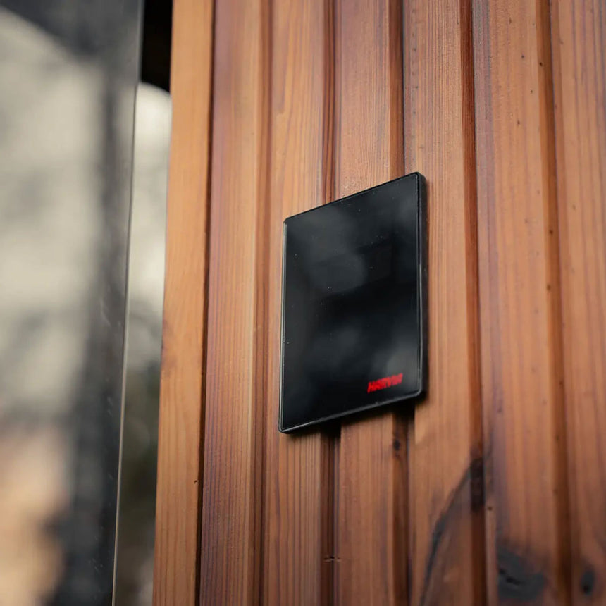 Harvia sauna control panel shown mounted on the exterior wall of the Celsium Jonas Grand