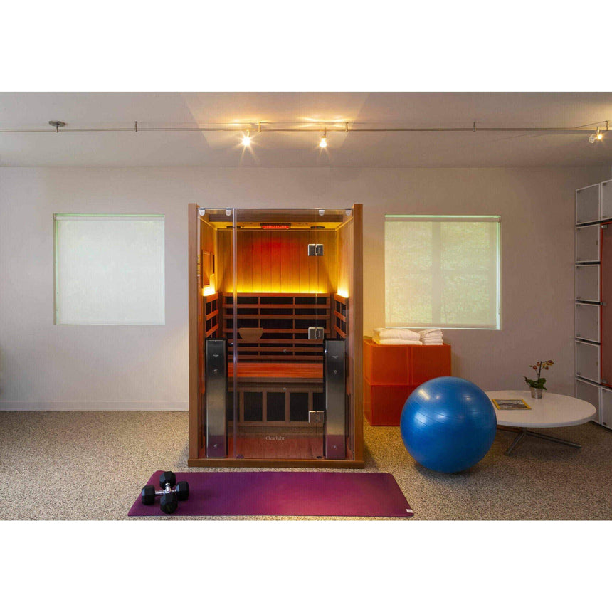 Clearlight Sanctuary 2 infrared sauna home gym installation wide angle showing chromotherapy glow