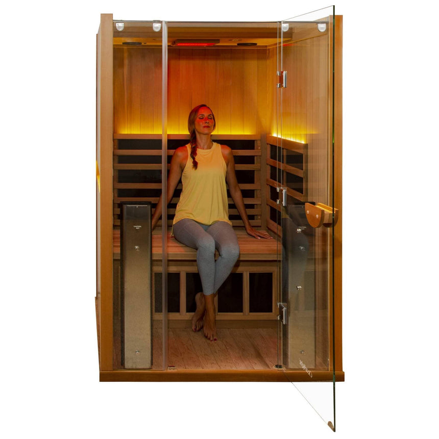 Woman relaxing inside Clearlight Sanctuary 2 full spectrum infrared sauna with chromotherapy lighting