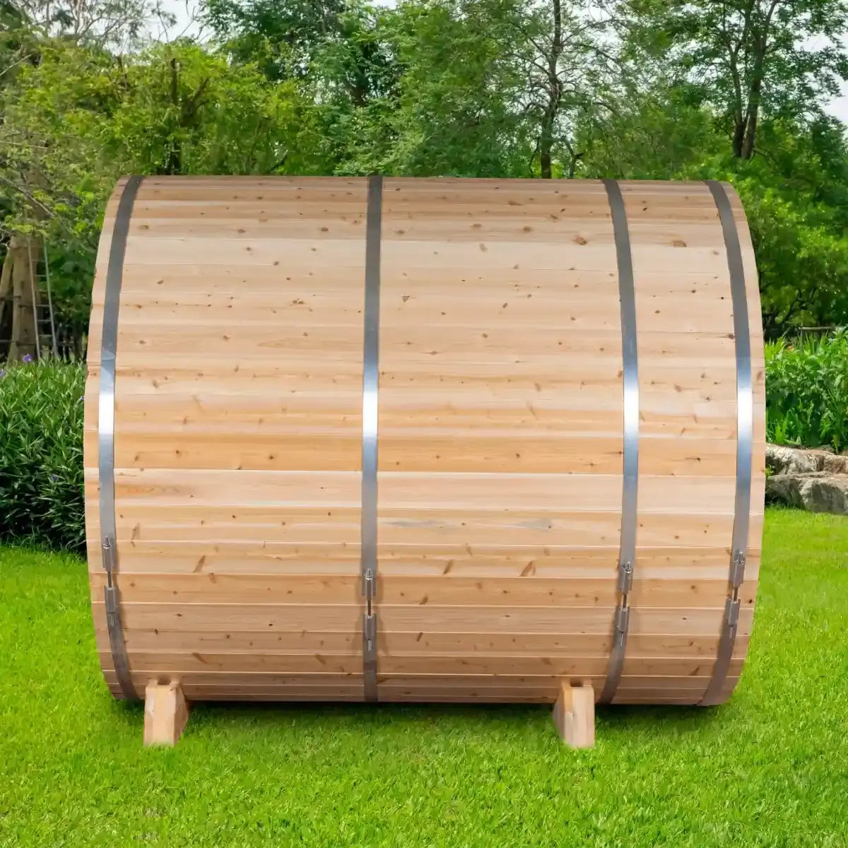 An exterior view of the Dundalk Leisure Craft CT Serenity MP Barrel Sauna (CTC2245MPE) from the back, highlighting the smooth cedar wood staves and the steel bands.