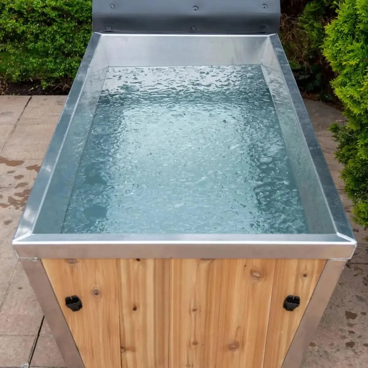 Front view of the Dundalk Leisurecraft Polar Plunge Tub (CT362PP) showcasing its cedar and metal construction with an ice water fill.