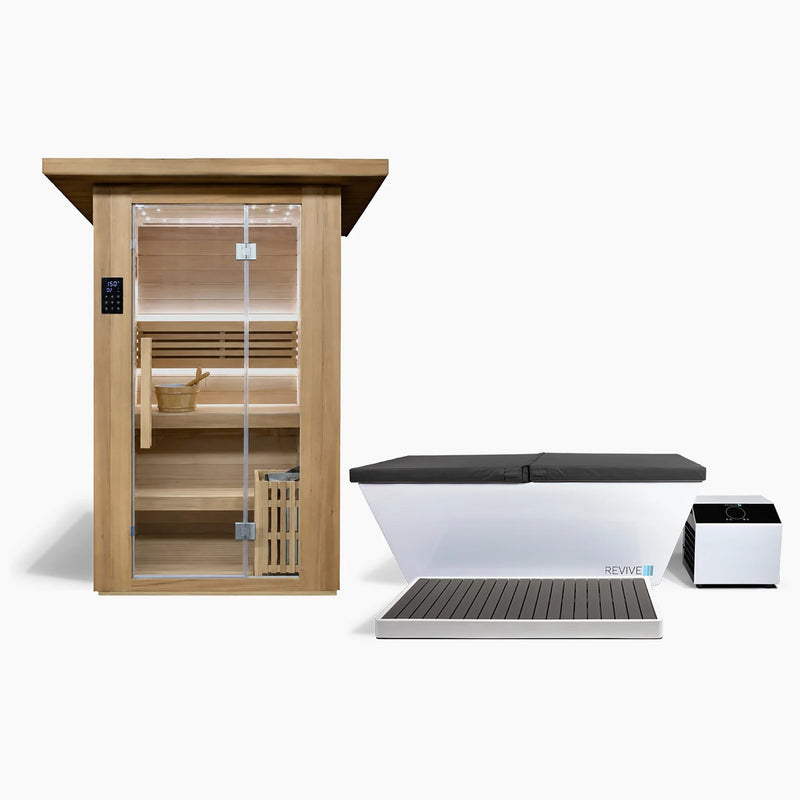 Revive 2 Person Traditional Sauna and Revive Acrylic Plunge side by side: the hemlock sauna with its glass door, touchscreen control panel, two-tier benches, bucket and ladle and the heater behind a wooden guard, and the white acrylic tub with its spa cover on and its chiller beside it, shown with the optional Acrylic Basin in front