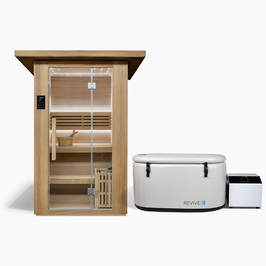 Revive 2 Person Traditional Sauna and Revive Inflatable Plunge side by side: the hemlock sauna with its glass door, touchscreen control panel, two-tier benches, bucket and ladle and the heater behind a wooden guard, and the inflatable tub with its cover strapped on and its chiller beside it