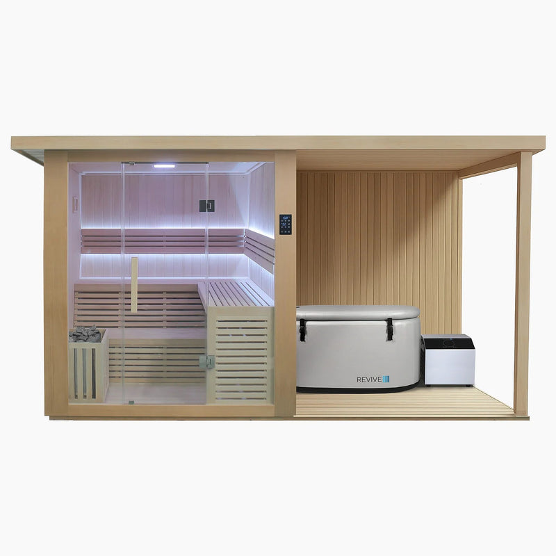 Revive 4 Person Extended Sauna and Revive Inflatable Plunge: the sauna with its full glass front and glass door, touchscreen control panel, L-shaped two-tier benches, LED lighting and the heater behind a wooden guard, and the covered deck beside it, where the inflatable tub with its cover strapped on stands along the back wall with its chiller beside the tub's end
