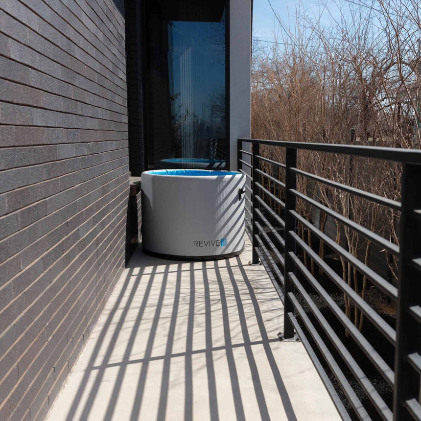 Revive Inflatable Pod Plunge set up at the end of a narrow balcony