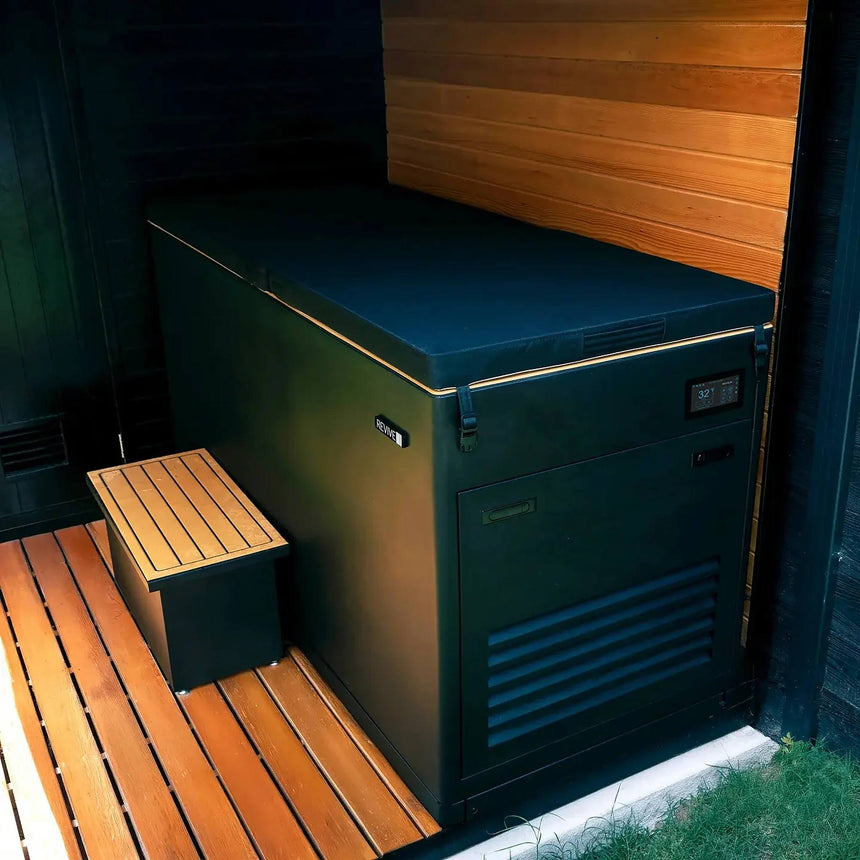 Revive Luxury Plunge with full insulated plunge cover and matching step beside a cedar wall