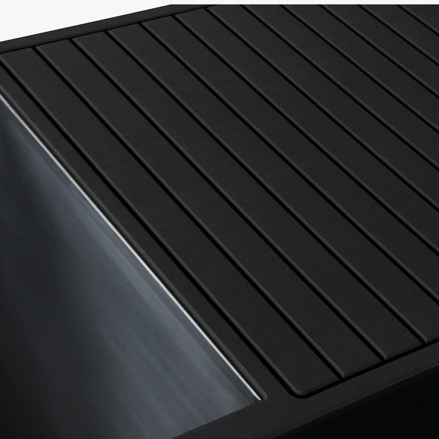 Revive Luxury Plunge black EVA foam decking next to the stainless steel tub