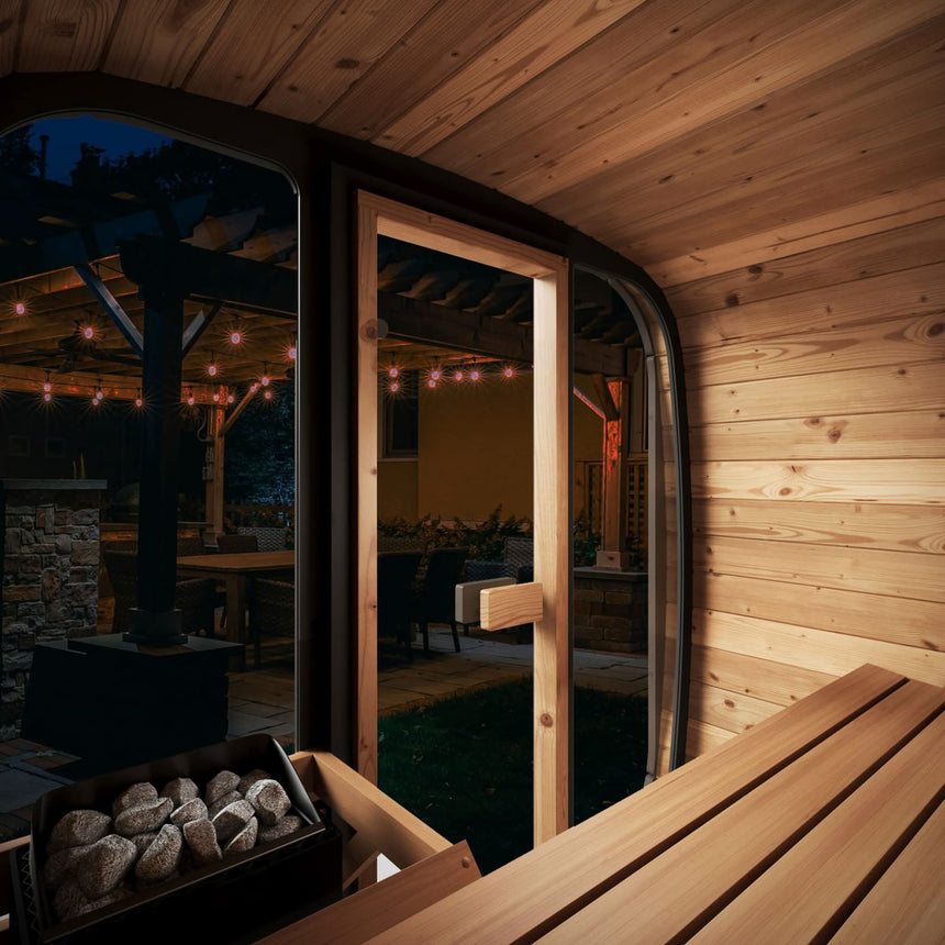 Interior night-time view of the CL4G through the full glass front, highlighting the outdoor patio and ambient lighting (relevant for the LED Light System feature).