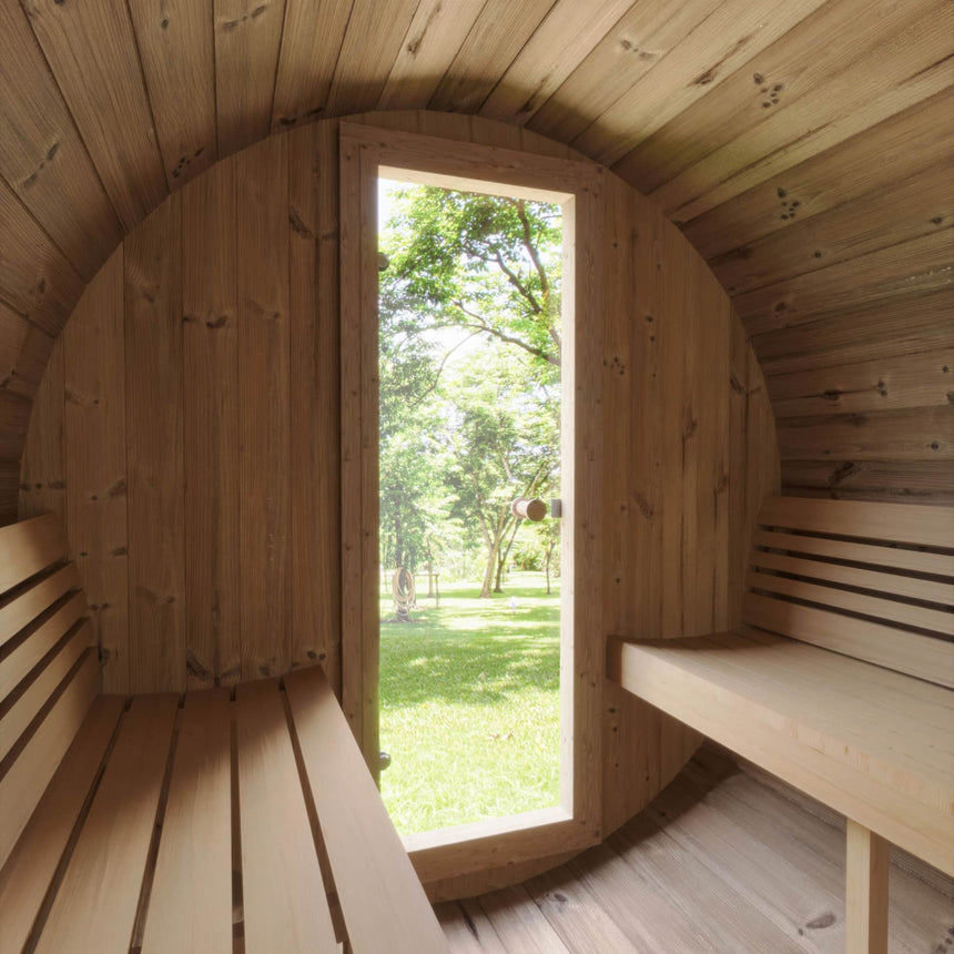 Interior view of the E7W showing the benches and the glass door open to the grassy outdoor space.