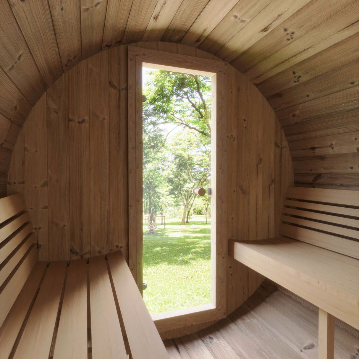 Interior view of the SaunaLife E8 Barrel Sauna looking out the door to a green outdoor landscape.