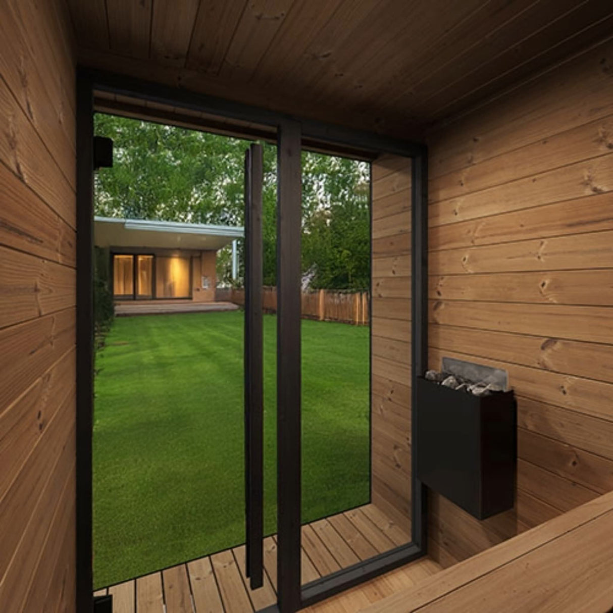 SaunaLife Model GL4 Garden Luxury sauna interior view through bronze glass door showing backyard landscape and electric heater.