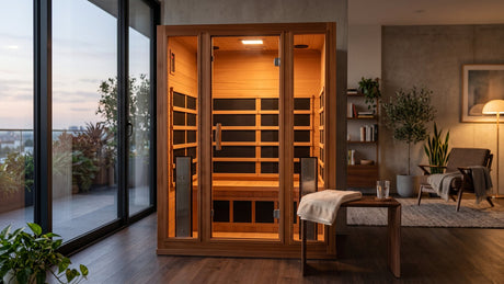 Home infrared sauna cabin glowing in a living space at dusk
