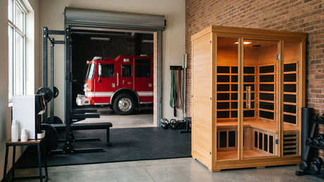Sauna for firefighters: an infrared sauna cabin in a fire station fitness room