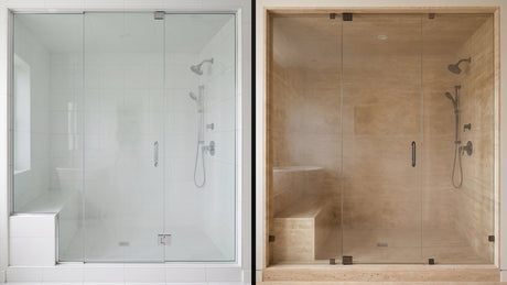 Two residential steam showers side by side, one in white porcelain tile and one in warm natural stone