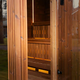 View through the doorway of the Celsium Jonas Grand to two-tier benches lit by LED strips