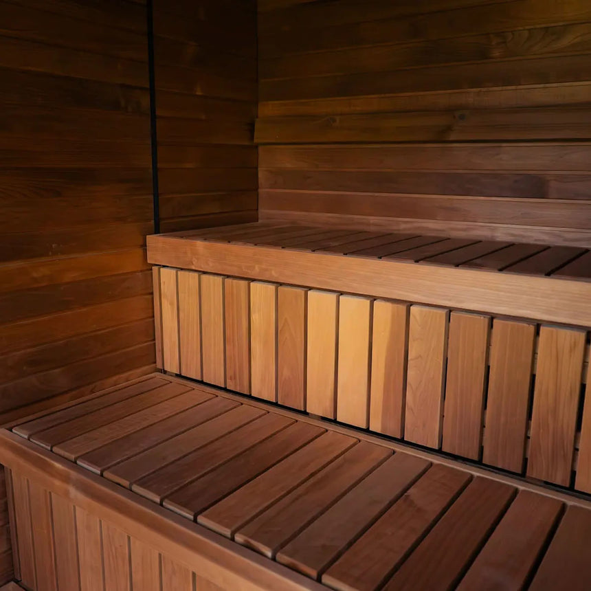 Two straight benches, an upper and a lower tier, inside the Celsium Jonas Grand outdoor sauna