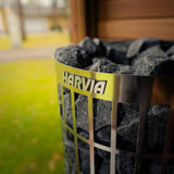 Close-up of a Harvia sauna heater filled with stones, shown in the Celsium Jonas Grand