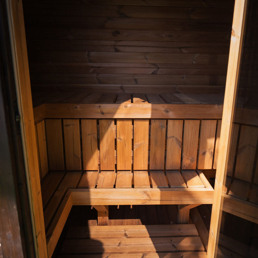View through the doorway of the Celsium Ula Mini to the benches and ThermoWood interior