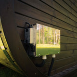 Electrical enclosure with an LED power supply and a switch on an exterior wall of a brown Celsium Ula Mini outdoor sauna