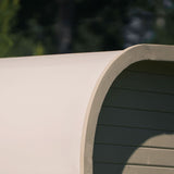 Close-up of the rounded corner on a light-colored Celsium Ula Mini outdoor sauna