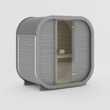 Rendering of the Celsium Ula Mini outdoor sauna in Grey ThermoWood, shown with a timber front and a central glass door