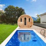 A Dundalk LeisureCraft Canadian Timber CT Elation Sauna (CTC2424E) placed on a wooden deck next to a swimming pool, showing a relaxing lifestyle scene.