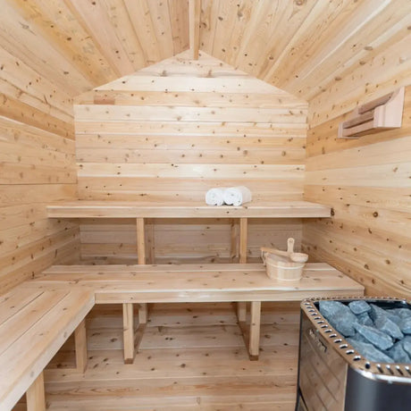 The interior of a Dundalk LeisureCraft CT Georgian Cabin Sauna (CTC88E) showing the wooden benches and sauna accessories.