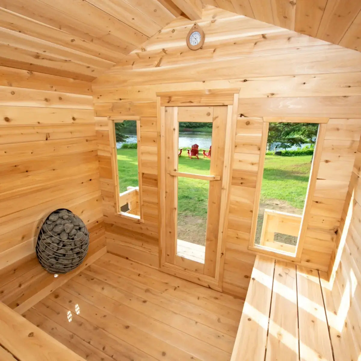 Interior view of a Dundalk LeisureCraft CT Georgian Cabin Sauna with Porch (CTC88PE), looking out through the front glass door towards the porch.