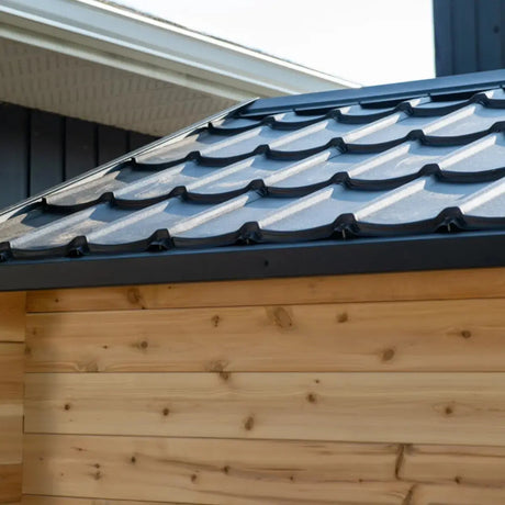 A close-up view of the metal roof shingles on the Dundalk LeisureCraft Georgian Cabin Sauna with Porch (CTC88PE).