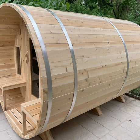 A side exterior view of the Dundalk Leisure Craft CT Tranquility MP Barrel Sauna (CTC2345MPE), highlighting the rounded barrel shape and steel bands.