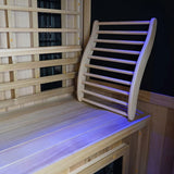 Finnmark FD-1 infrared sauna interior showing Western Canadian cedar backrest with chromotherapy blue lighting and carbon 360 heater panels.