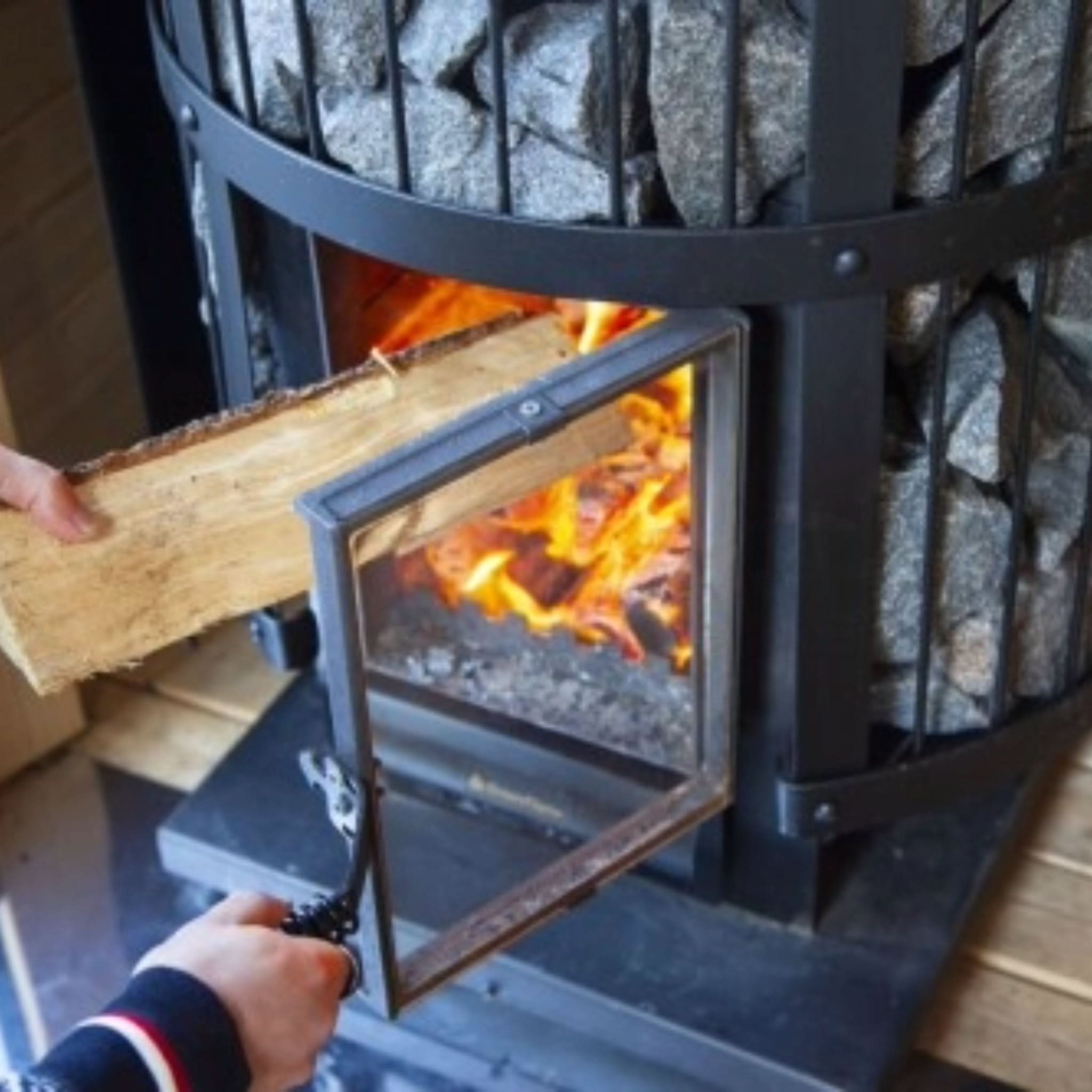 Fire visible through wood stove door
