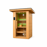 Three-quarter view of the Revive 2 Person Traditional Sauna with its glass door, roof overhang and LED lighting set to green