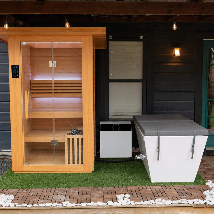 Revive 2 Person Traditional Sauna on a covered patio beside the Revive Acrylic Plunge, which is sold separately