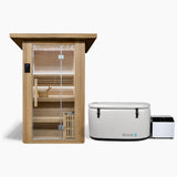 Revive 2 Person Traditional Sauna and Revive Inflatable Plunge side by side: the hemlock sauna with its glass door, touchscreen control panel, two-tier benches, bucket and ladle and the heater behind a wooden guard, and the inflatable tub with its cover strapped on and its chiller beside it