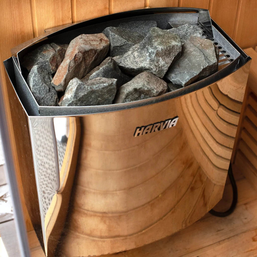 Harvia heater filled with sauna stones inside the Revive 4 Person Traditional Sauna