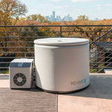 Revive Inflatable Pod Plunge with insulated cover and chiller on a terrace overlooking a city skyline