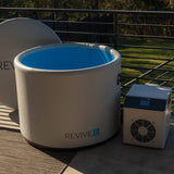 Revive Inflatable Pod Plunge open to show the blue interior, with its chiller on a terrace