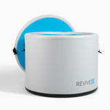 Open Revive Inflatable Pod Plunge with the cover's blue underside behind the tub