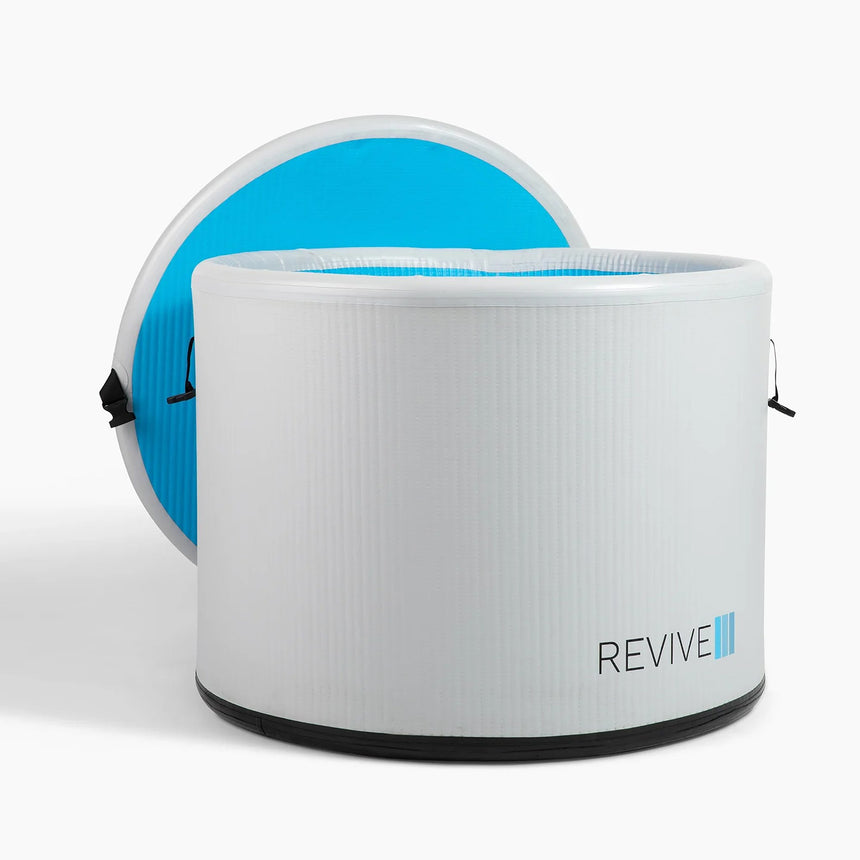 Open Revive Inflatable Pod Plunge with the cover's blue underside behind the tub