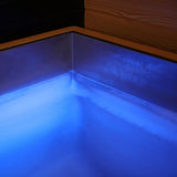 Revive Luxury Plunge stainless steel tub lit blue by its color-changing LED light