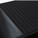 Revive Luxury Plunge black EVA foam decking next to the stainless steel tub