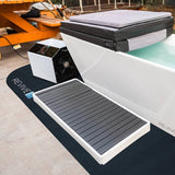 Revive Padded Protective Mat on a backyard patio under a Revive Acrylic Plunge with its cover folded back, its chiller and the Revive Acrylic Basin; the plunge, chiller and basin are sold separately