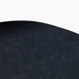 Close-up of the finely textured black surface and rounded edge of the Revive Padded Protective Mat