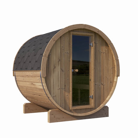 SaunaLife Model E7 3-Person Barrel Sauna front angle view with glass door and shingle roof.