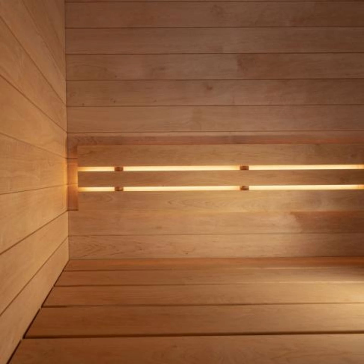 SaunaLife Model G6 sauna interior showing dimmable LED lighting behind backrest with warm ambient glow.
